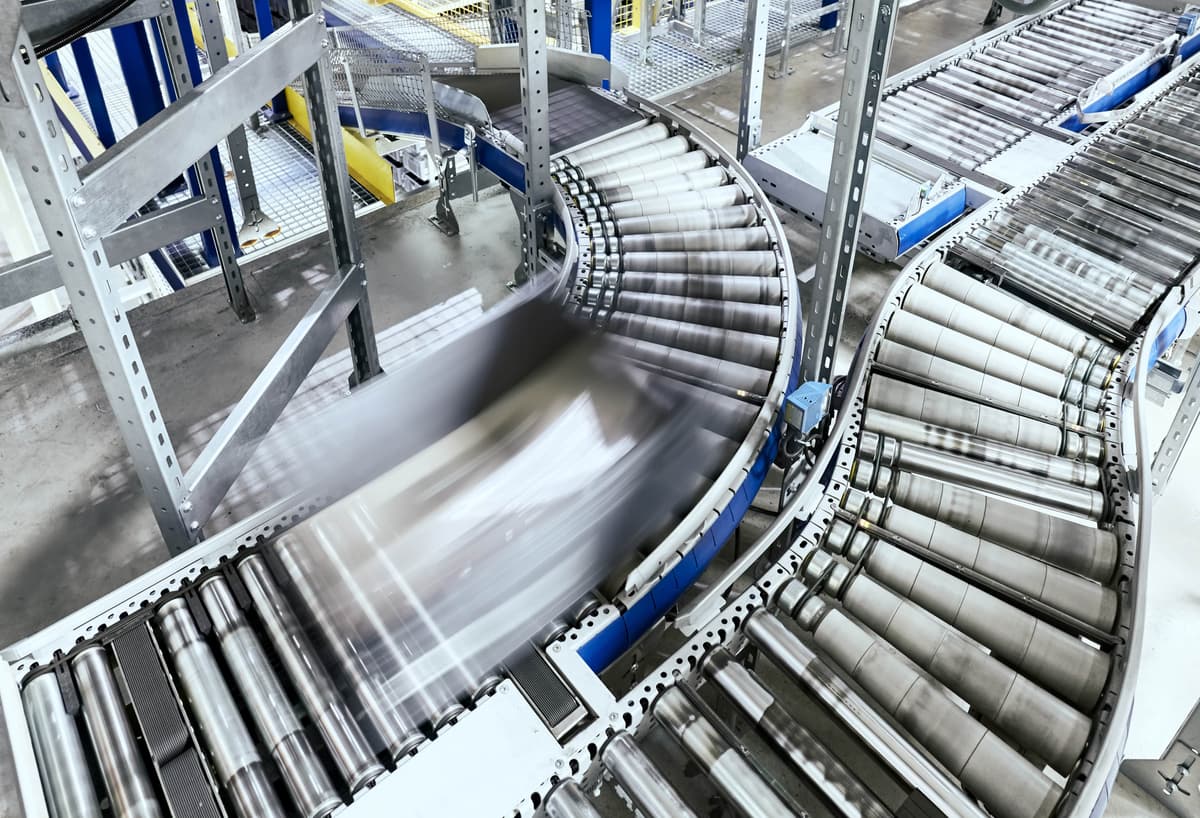 Factory workers collaborating in manufacturing environment